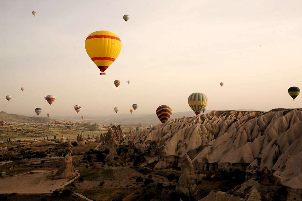 Hot air balloons over Cappadocia at sunrise